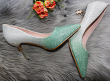 Green pointed shimmery heels